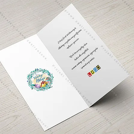 Karnet WN3-022 Niebieskie Alleluja w turkusowym kole, otwarty na stole, środek z miejscem na życzenia i logo